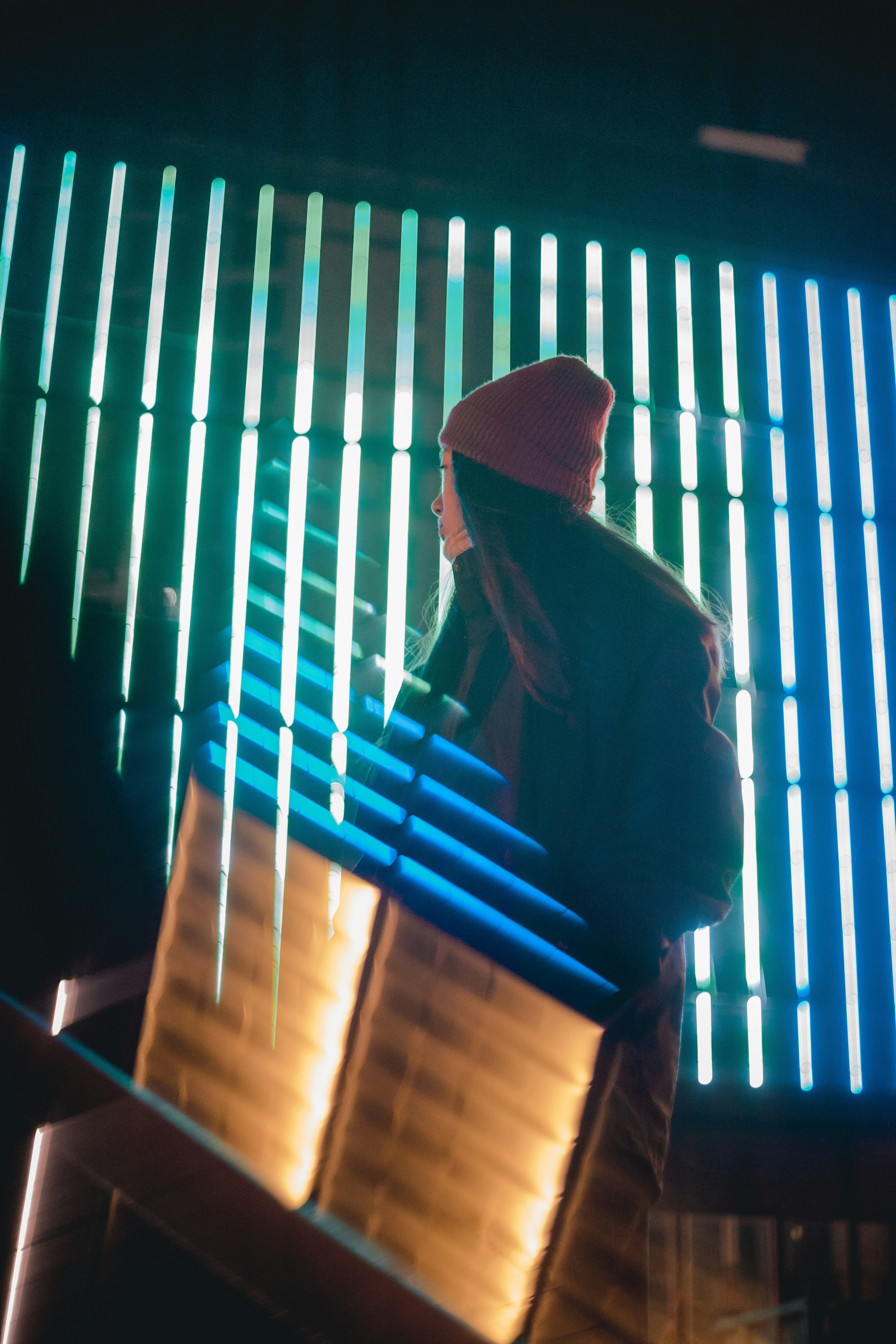 woman standing in front of LED signage